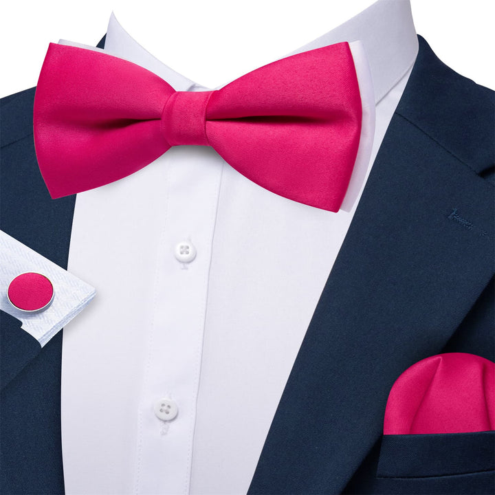 black suit pink bowtie