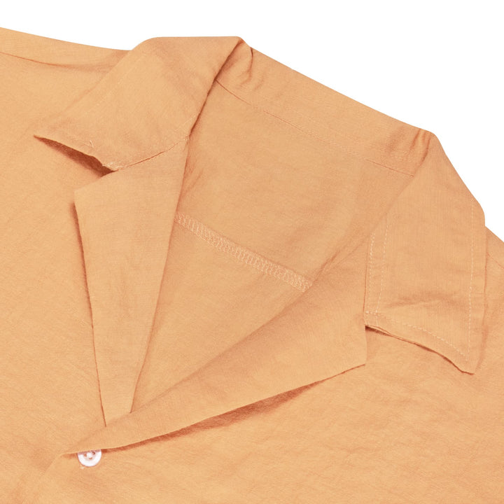 orange collared shirt