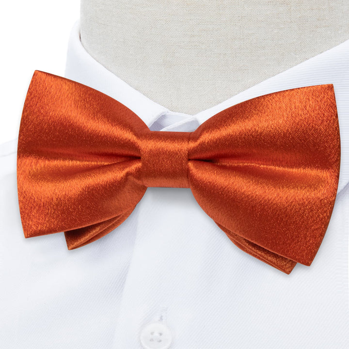 orange bow tie and suspenders